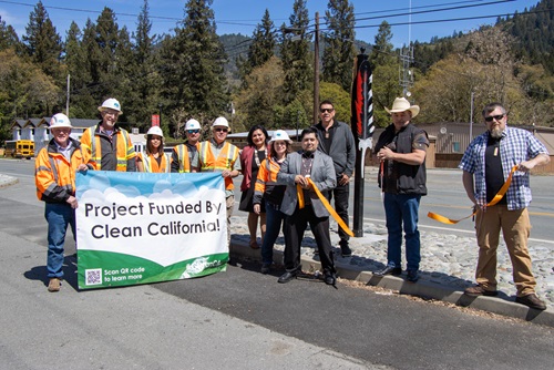Caltrans staff and Hoopa Valley Tribe officials gather at a ribbon cutting ceremony for the Hoopa Downtown Beautification Project