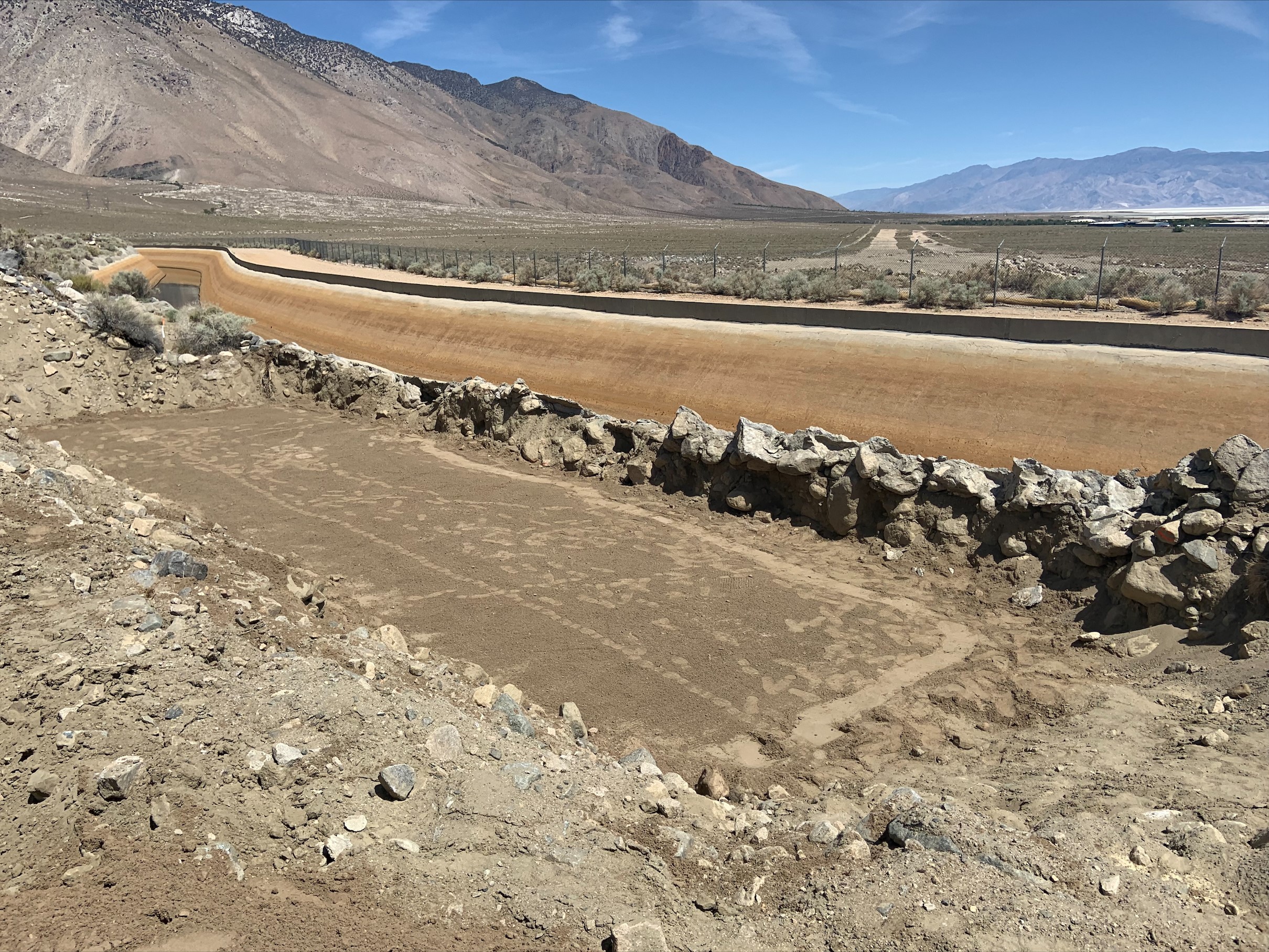 The foundation for the bridge abutment over the Los Angeles Aqueduct is being prepared.